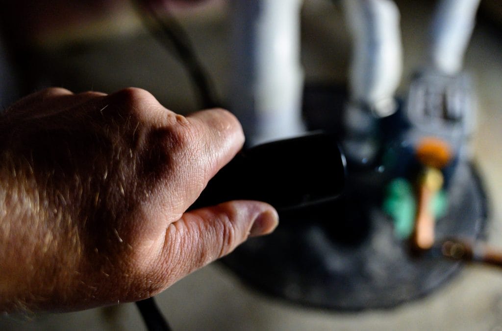 Close-up of a technician inspecting a system component in Arizona
