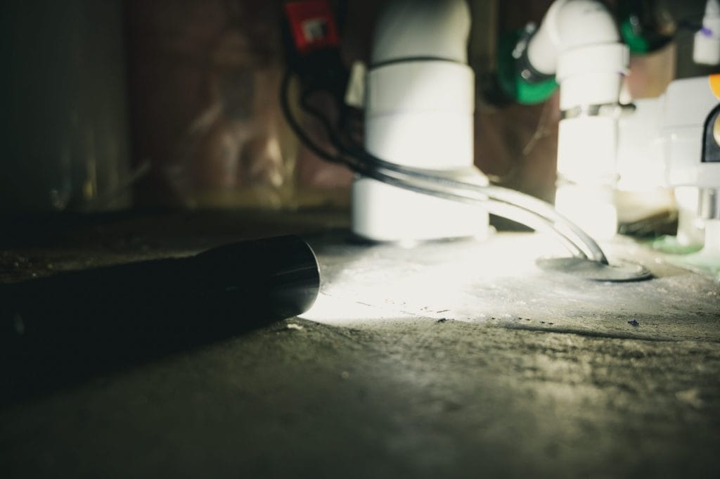 Flashlight illuminating radon system for repair
