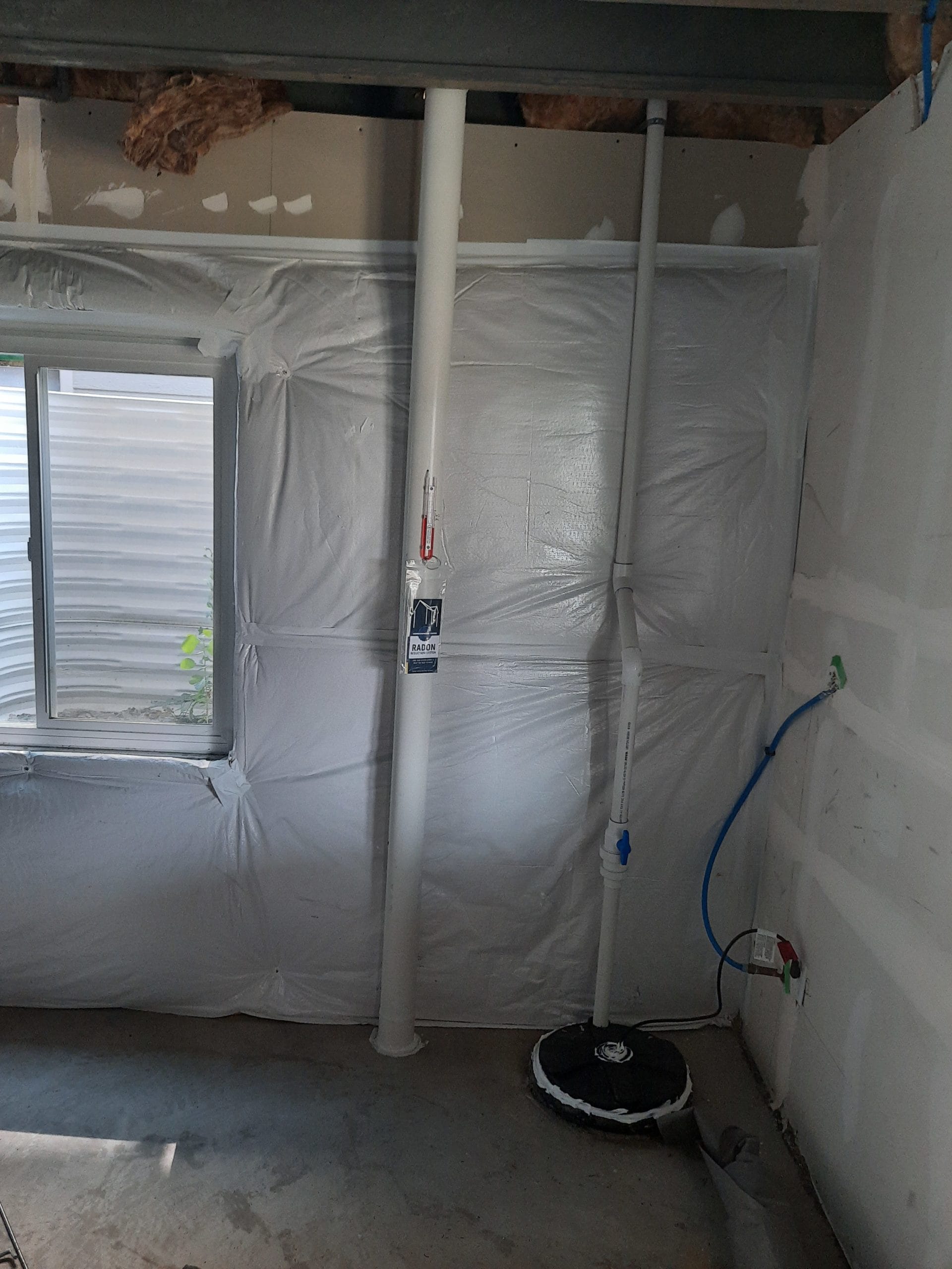 Radon mitigation system installed in New Mexico basement
