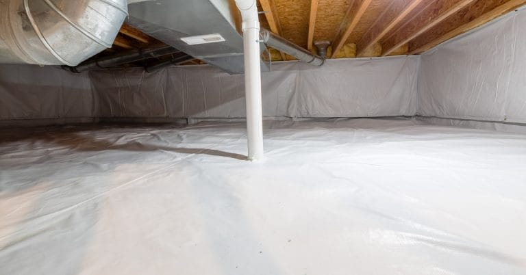 A crawlspace is encapsulated with a plastic vapor barrier. A radon venting pipe passes through the ground barrier.