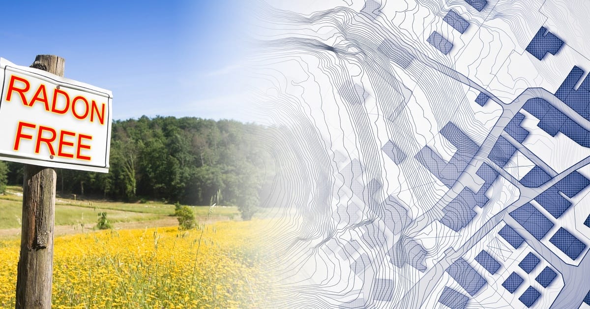 A sign on a post that says "Radon Free" next to a graphic map of businesses and plot lines. The post is in a field.